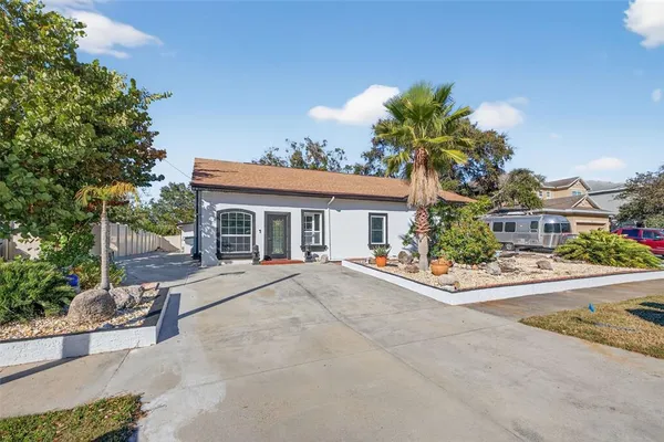 a front view of a house with a yard and a garage