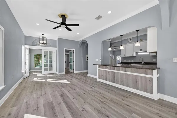 a view of kitchen with cabinets and wooden floor
