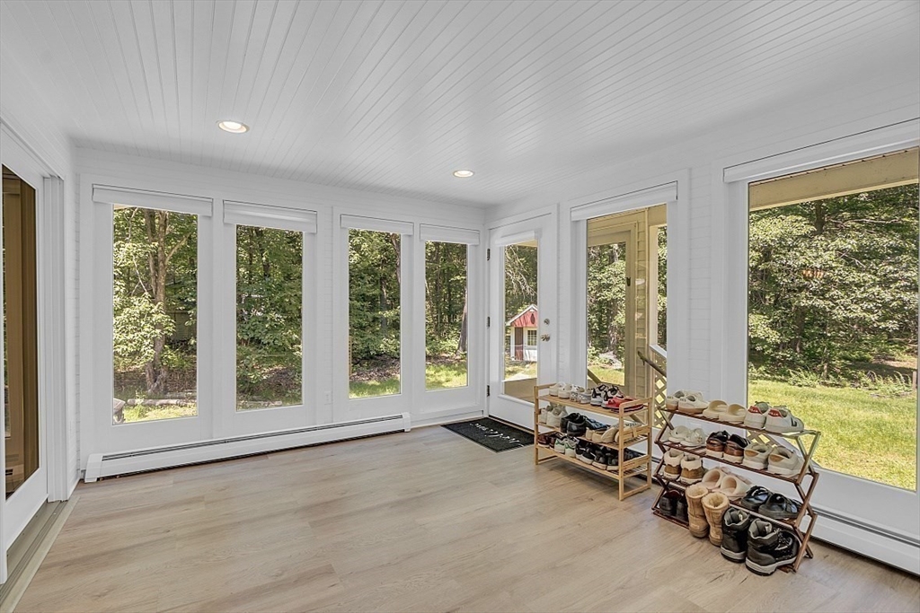 113 Townsend Road Shirley, MA 01464 - Photo 8 of 30 a view of a room with gym equipment and large windows