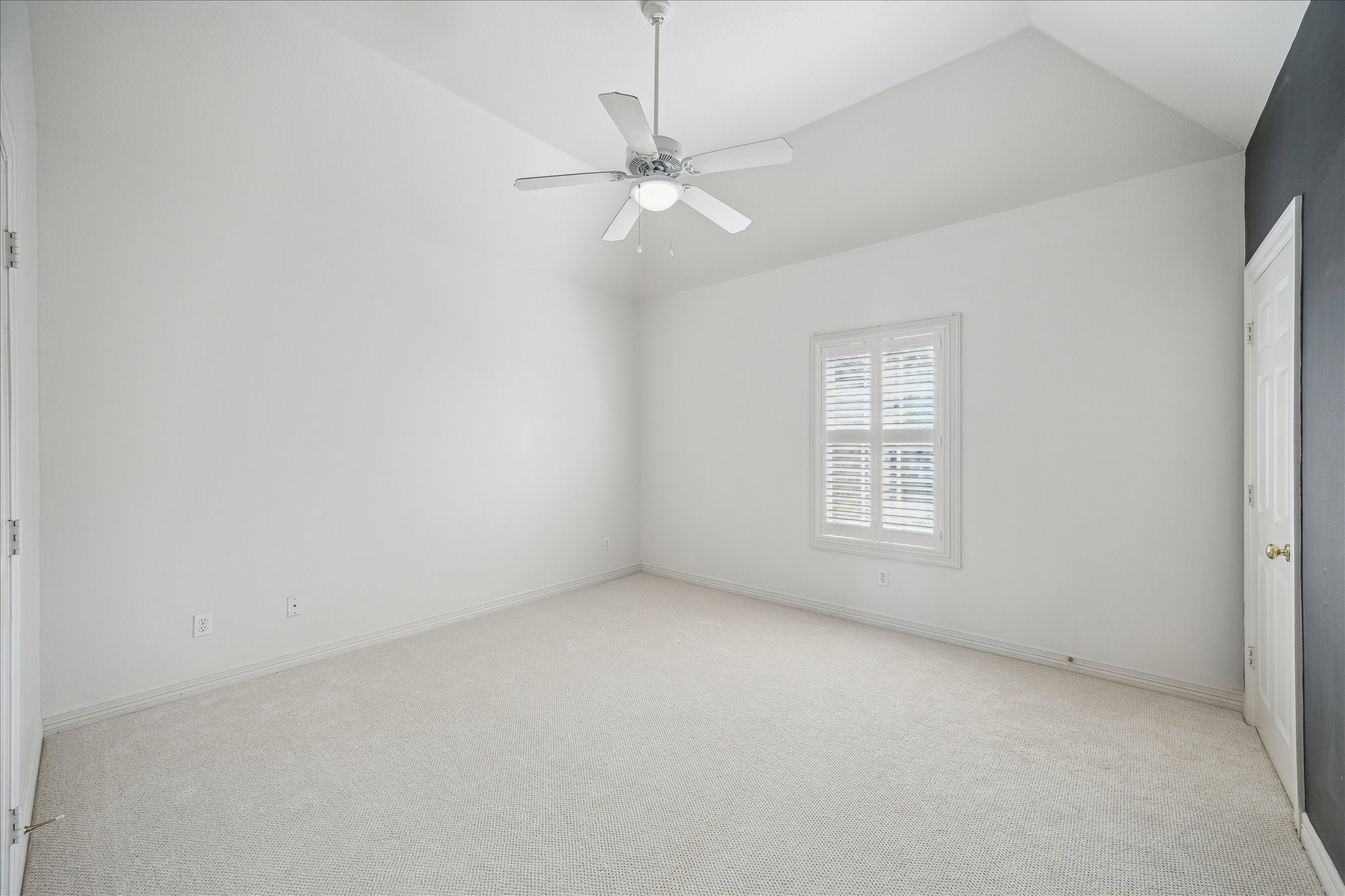 11524 Taylorcrest Road Houston, TX 77024 - Photo 34 of 47 Another secondary upstairs bedroom featuring a chalkboard wall, a window with plantation shutters, new carpet, high ceilings, a closet, and an adjoining Hollywood bathroom.