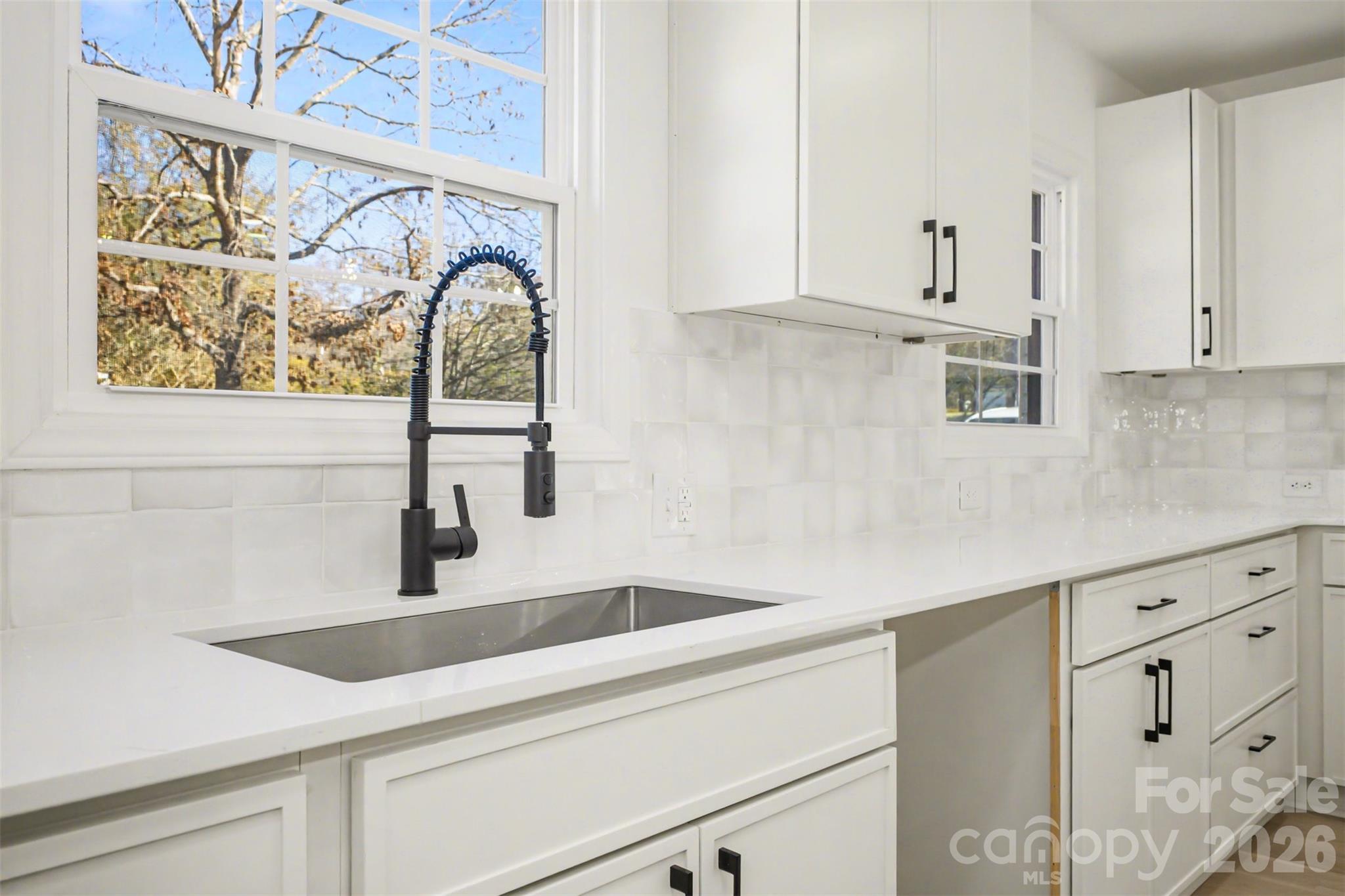 211 Ole Simpson Place Catawba, SC 29704 - Photo 14 of 38 a kitchen with stainless steel appliances granite countertop a sink and a white cabinets