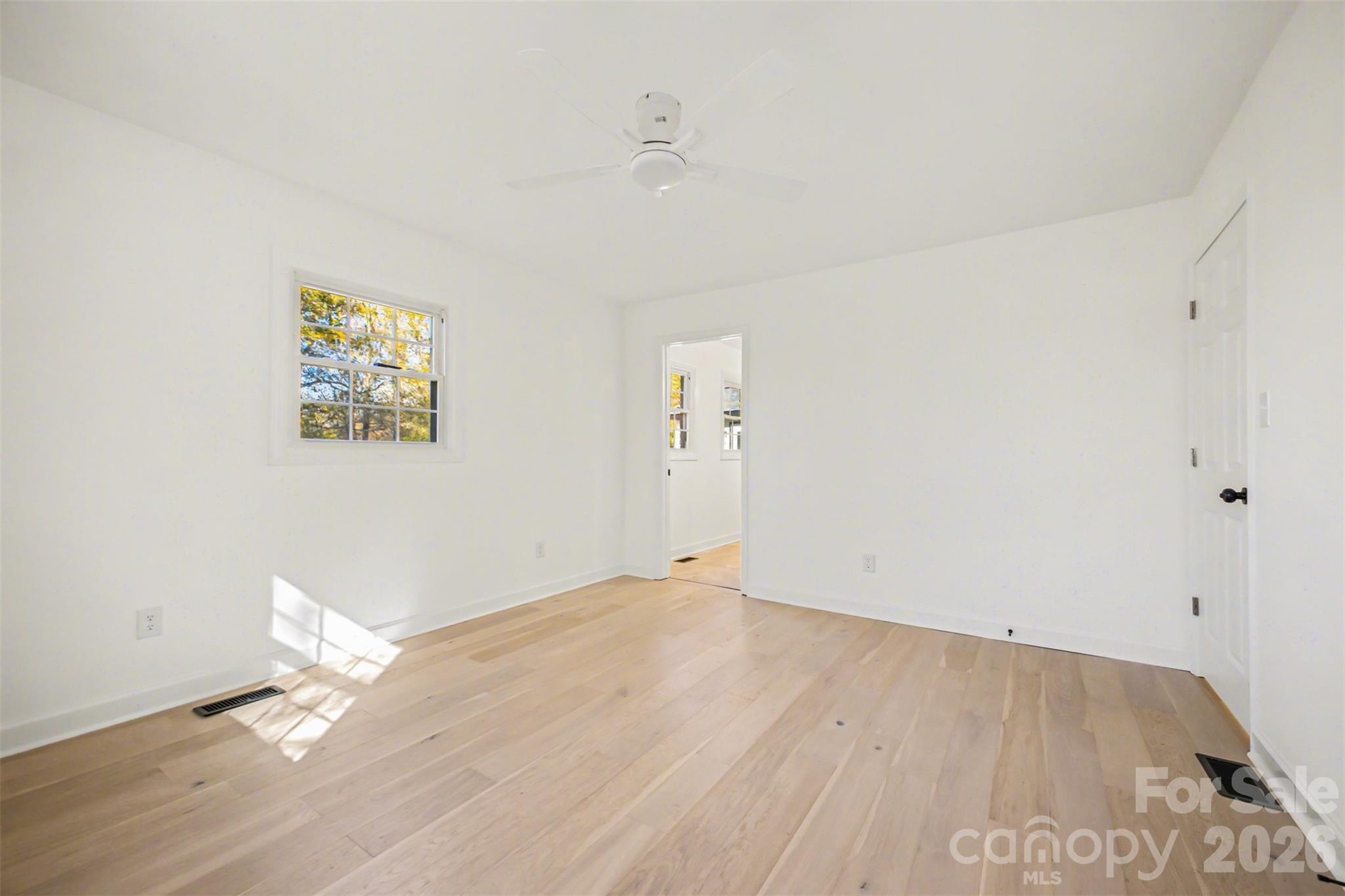 211 Ole Simpson Place Catawba, SC 29704 - Photo 21 of 38 an empty room with wooden floor and windows