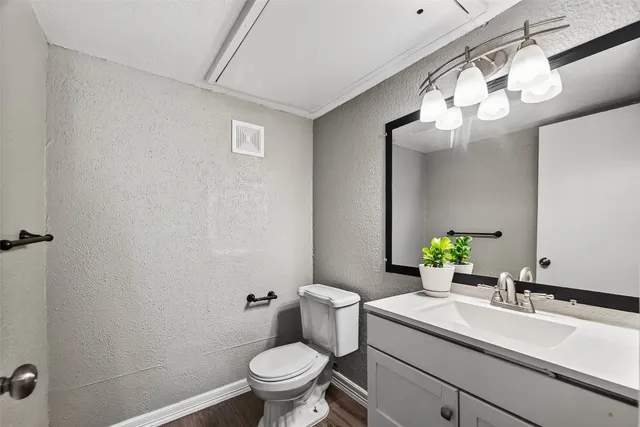 a view of an empty room with glass door and windows