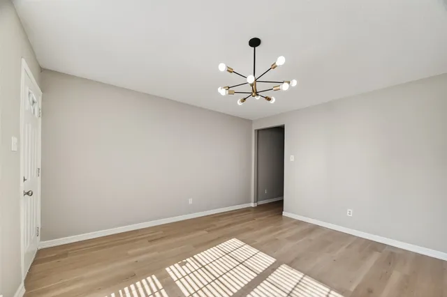 a view of kitchen with stainless steel appliances granite countertop refrigerator sink and stove