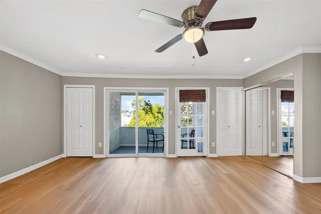 a view of a dining room with a table and chairs