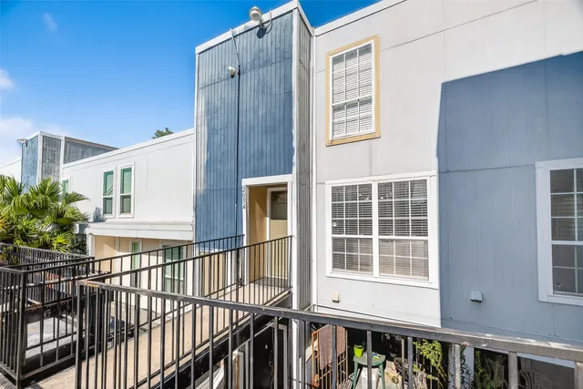 a view of a balcony and chairs