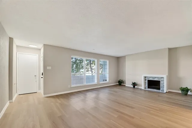 a view of a livingroom with wooden floor