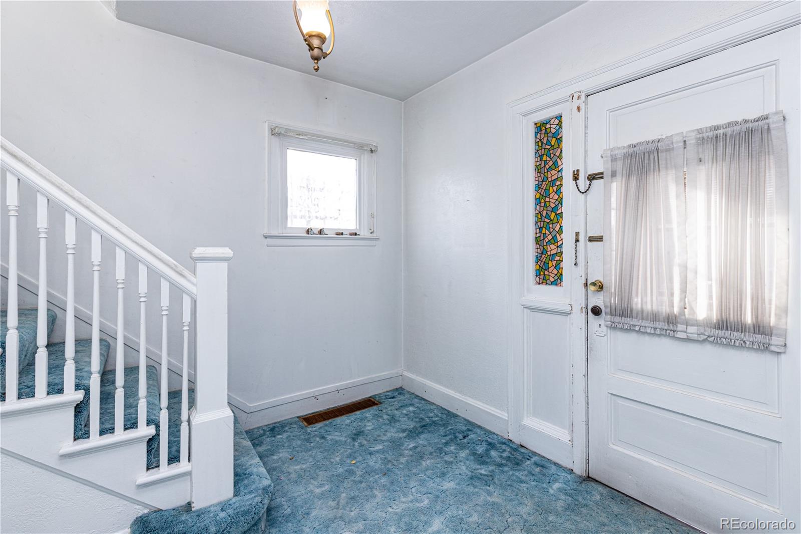4494 Meade Street Denver, CO 80211 - Photo 14 of 24 a view of an entryway with wooden floor