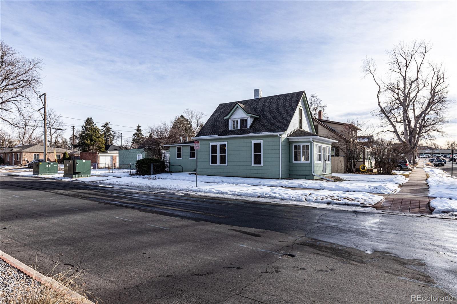 4494 Meade Street Denver, CO 80211 - Photo 20 of 24 a front view of a house with a yard