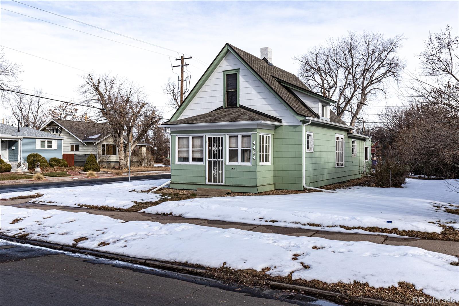 4494 Meade Street Denver, CO 80211 - Photo 2 of 24 a front view of a house with a yard
