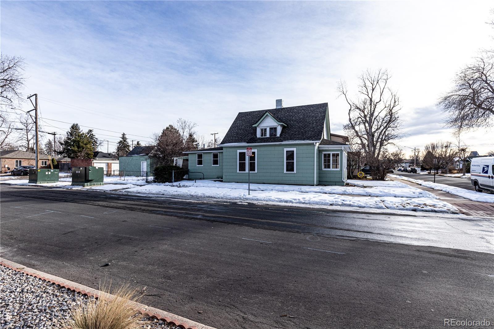 4494 Meade Street Denver, CO 80211 - Photo 21 of 24 a front view of a house with a yard