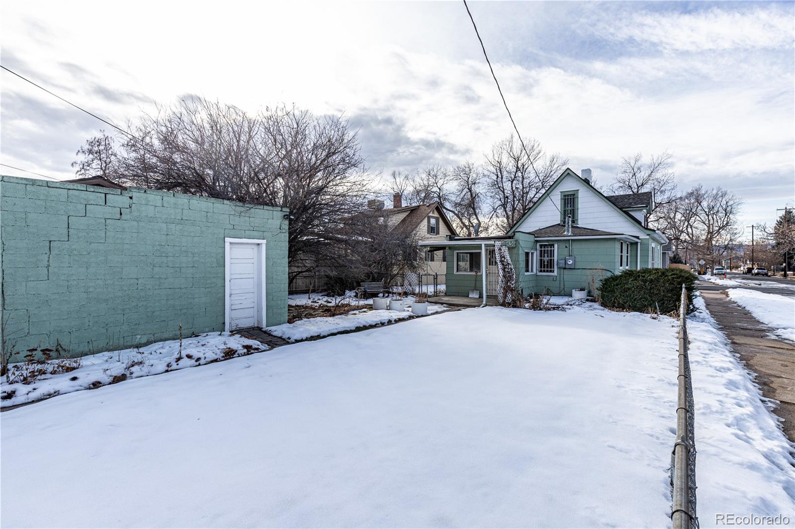 4494 Meade Street Denver, CO 80211 - Photo 23 of 24 a street view with wooden fence