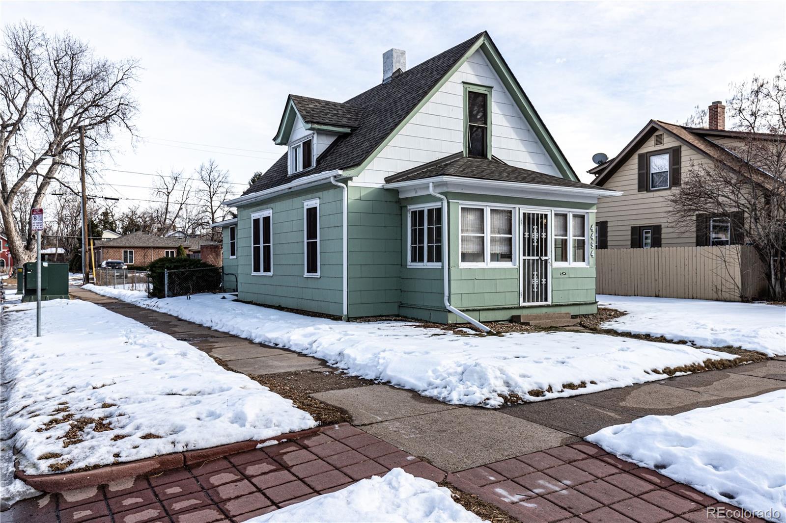 4494 Meade Street Denver, CO 80211 - Photo 3 of 24 a front view of a house with a yard