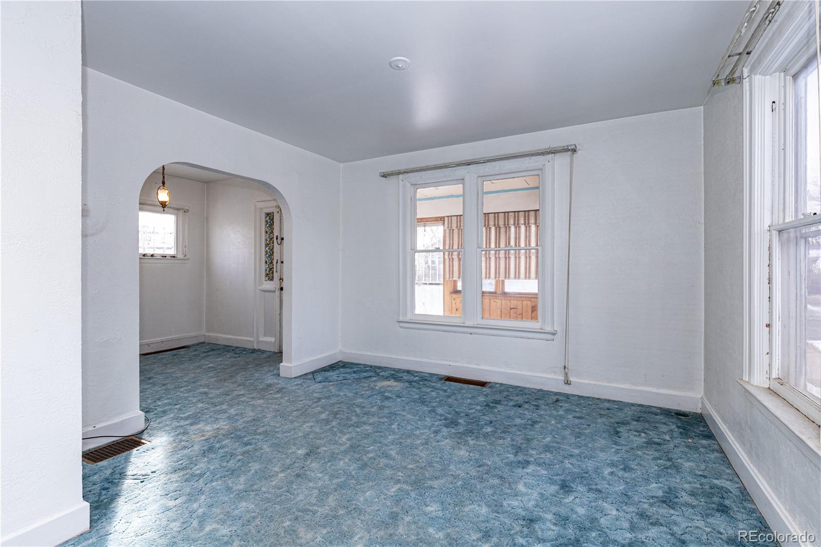 4494 Meade Street Denver, CO 80211 - Photo 4 of 24 an empty room with windows