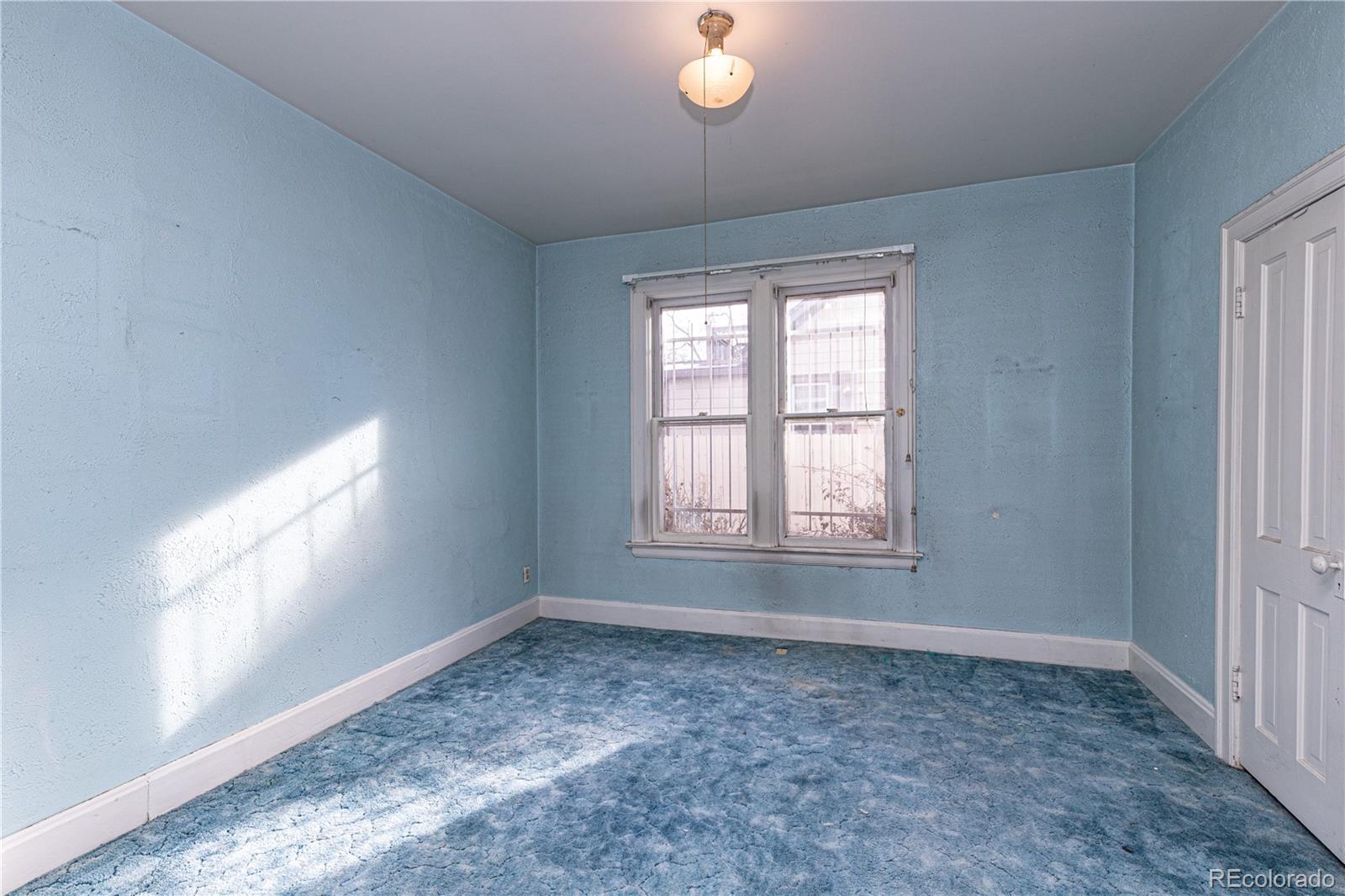 4494 Meade Street Denver, CO 80211 - Photo 7 of 24 an empty room with windows