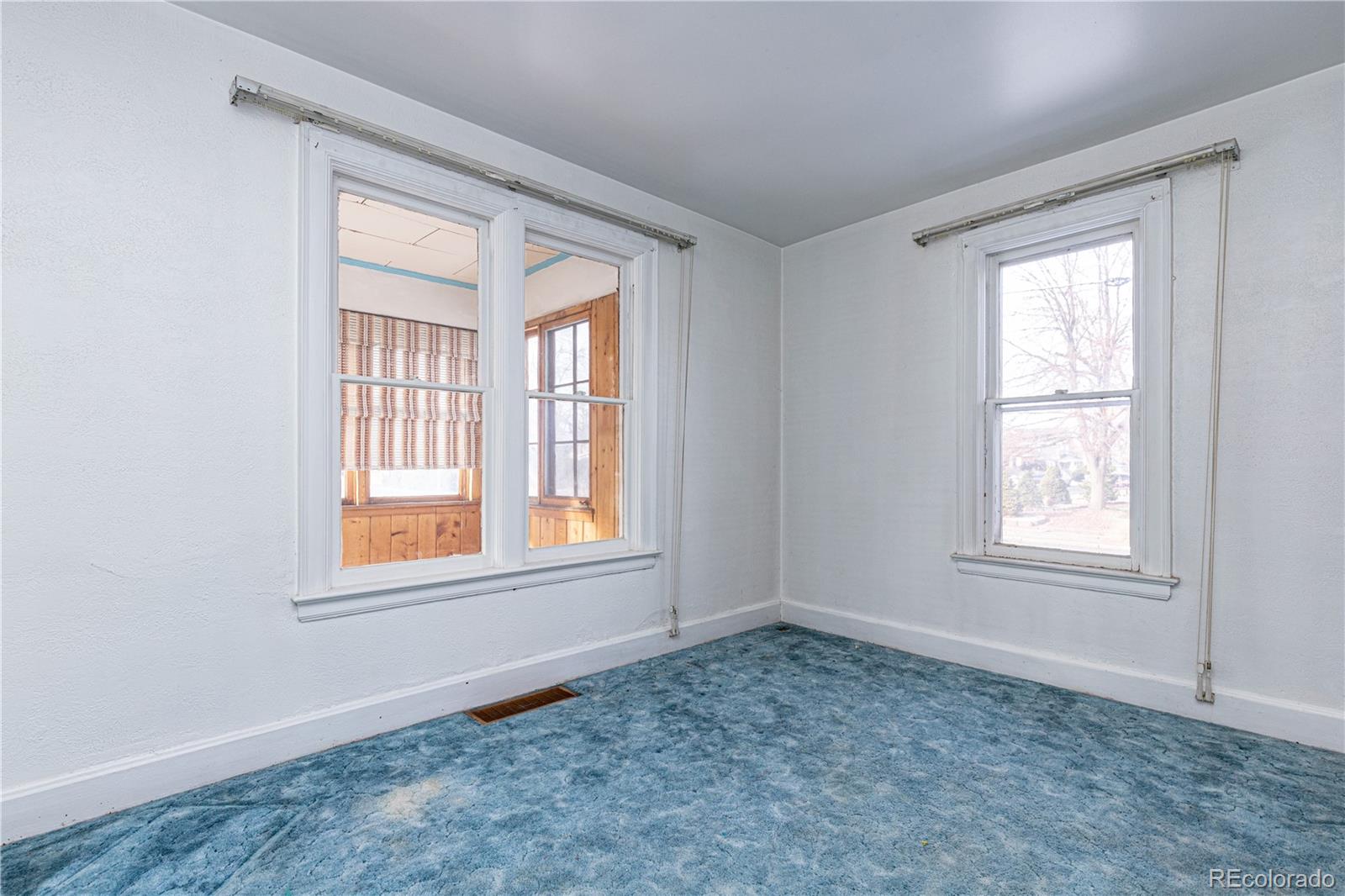 4494 Meade Street Denver, CO 80211 - Photo 9 of 24 an empty room with windows