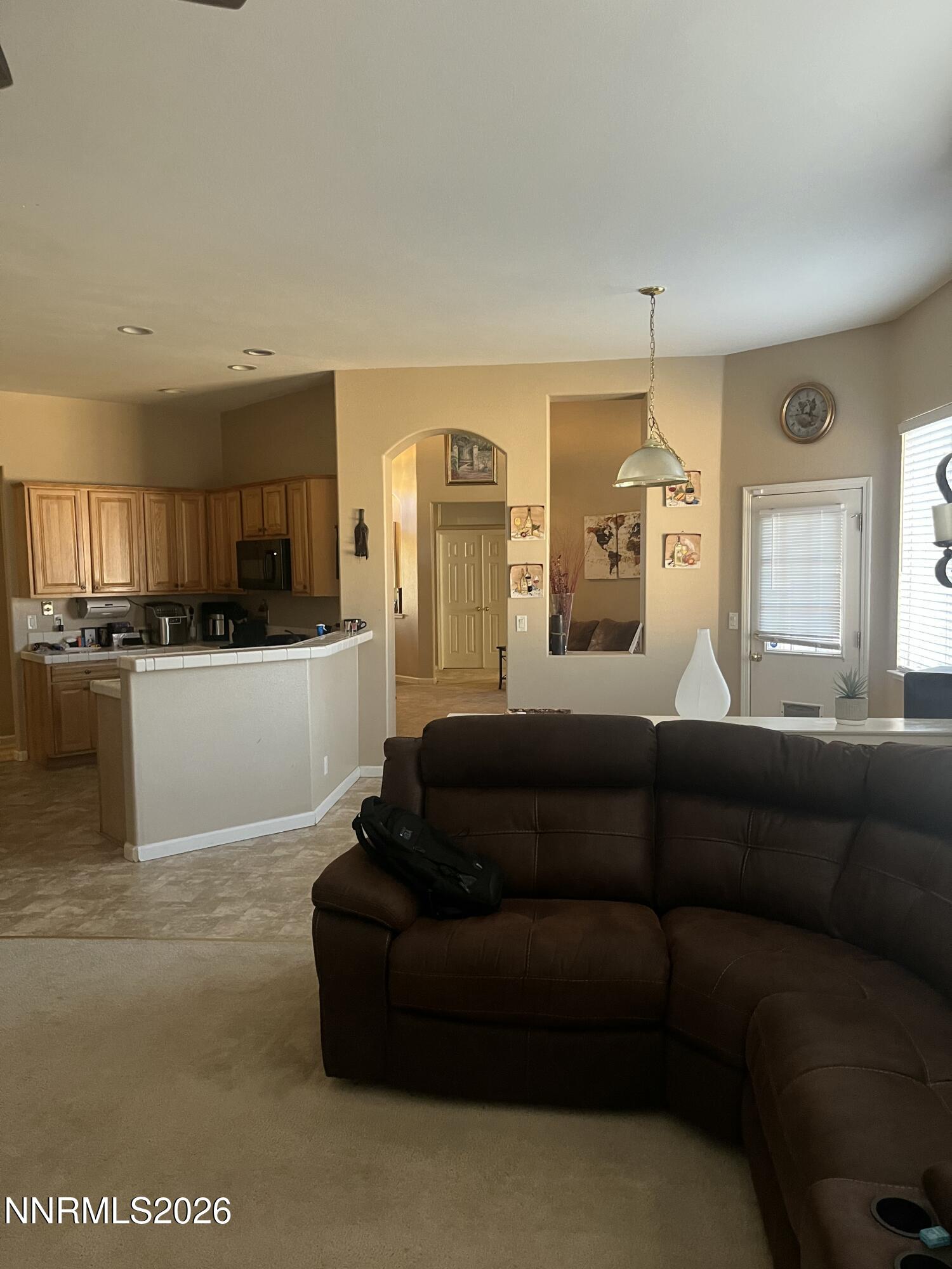 1895 Vintner Court Reno, NV 89519 - Photo 15 of 30 a living room with furniture and kitchen view