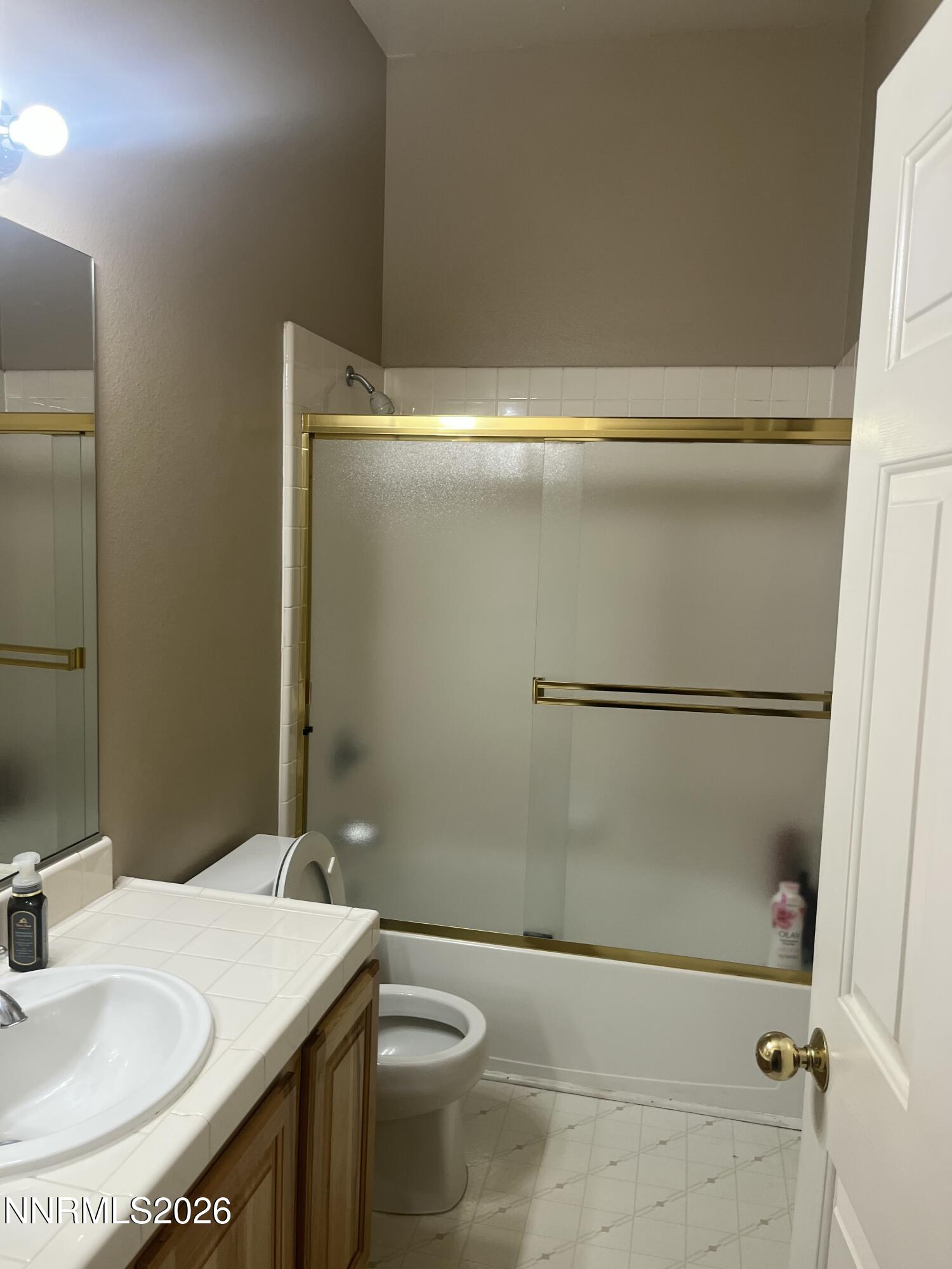 1895 Vintner Court Reno, NV 89519 - Photo 19 of 30 a bathroom with a sink and a mirror