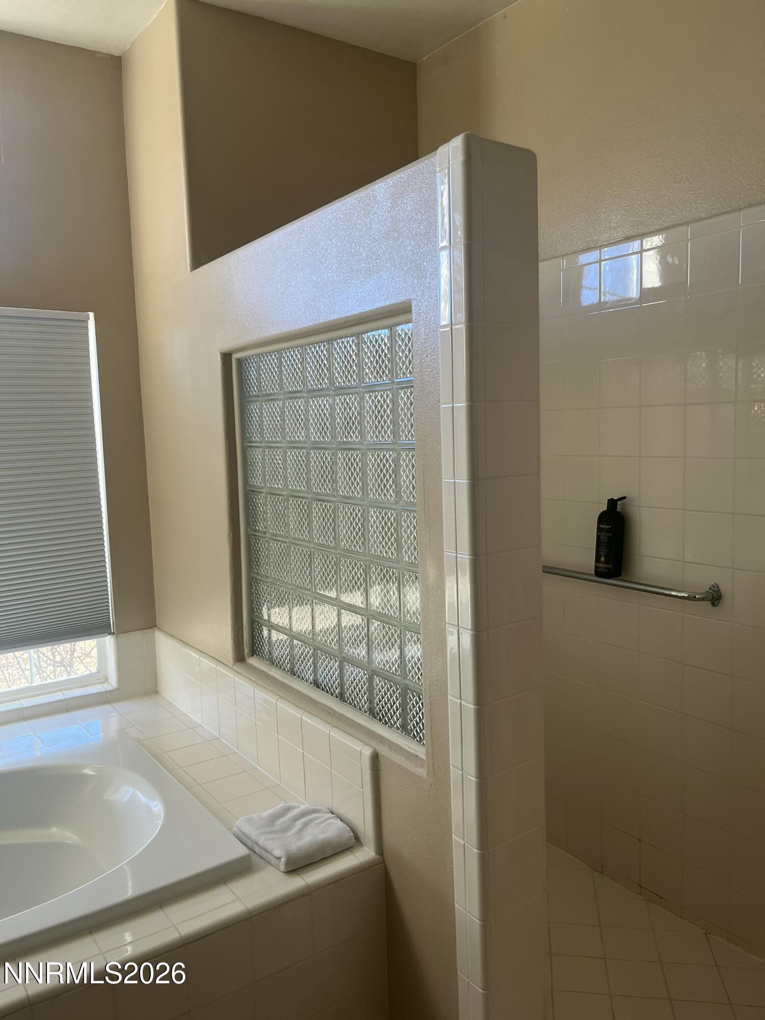 1895 Vintner Court Reno, NV 89519 - Photo 26 of 30 a bath tub sitting next to a window