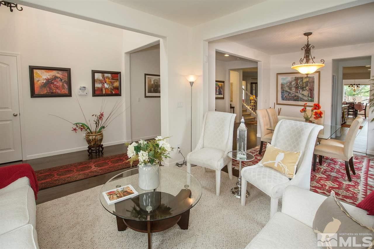 2025 Horse Prairie Road Reno, NV 89521 - Photo 2 of 25 a living room with furniture potted plant and a chandelier