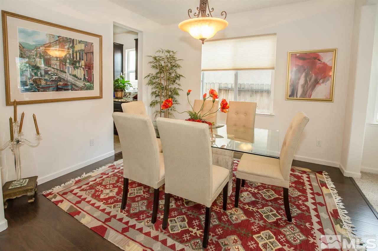 2025 Horse Prairie Road Reno, NV 89521 - Photo 4 of 25 a view of a dining room with furniture a rug and wooden floor