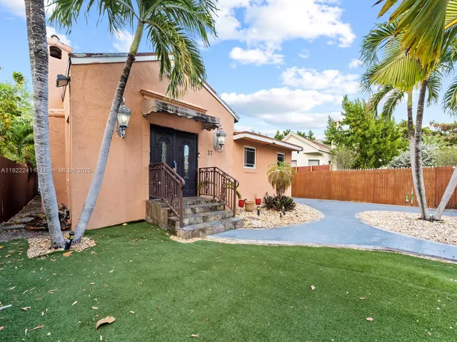 a view of backyard with a slide