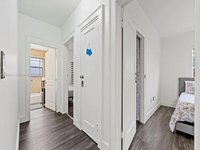 a bedroom with a bed and a table