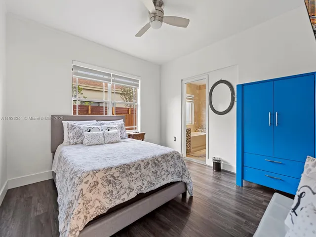 a bedroom with a bed and a table in it