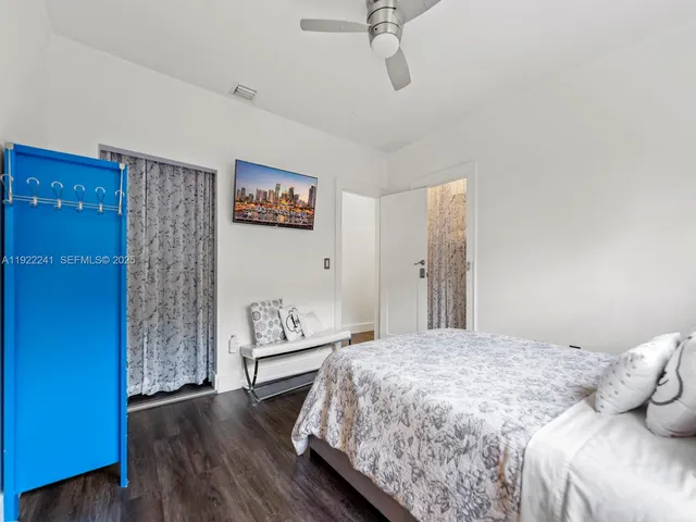 a bathroom with a tub sink shower and a mirror