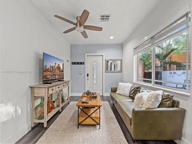 a living room with furniture and a table