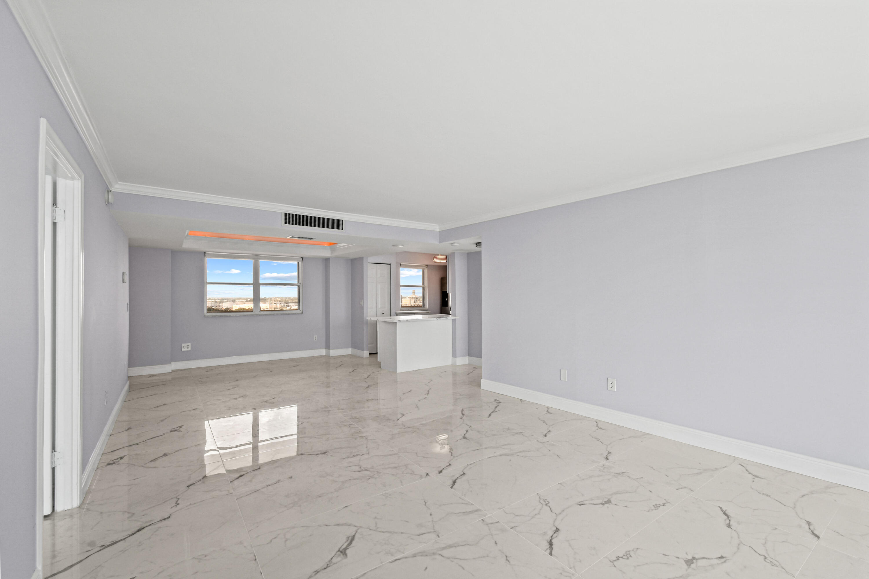 5200 North Flagler Drive, Unit 1404 West Palm Beach, FL 33407 - Photo 7 of 26 an empty room with windows and entrance