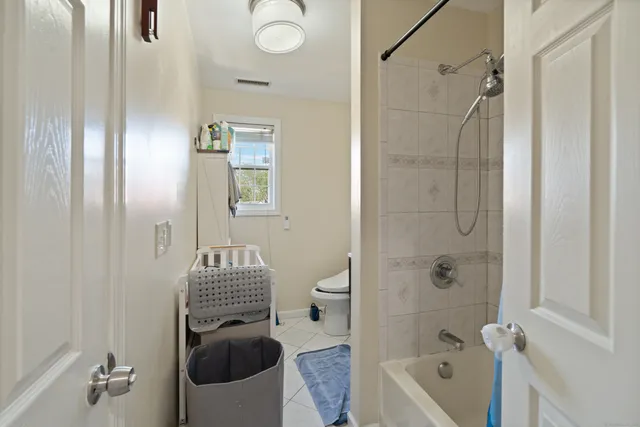 a bathroom with a tub and a shower
