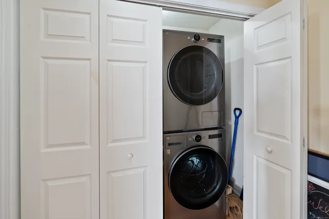 a view of a hallway with washer and dryer