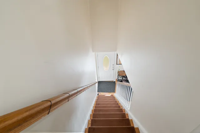 a view of a hallway with staircase