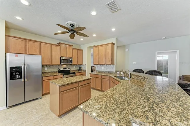 a kitchen with a stove and a microwave