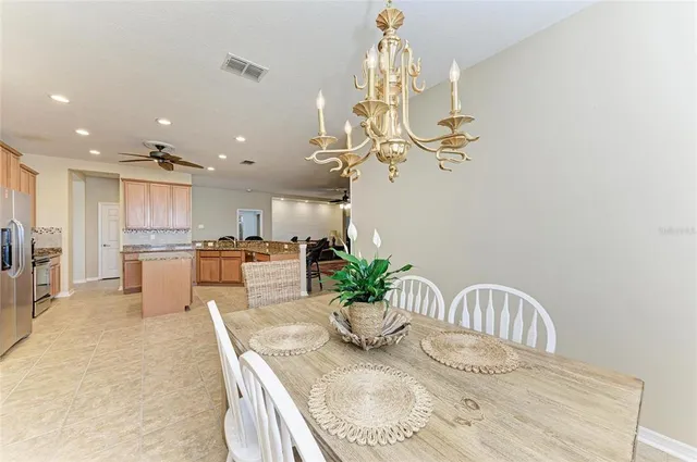 a living room with lots of furniture and a chandelier