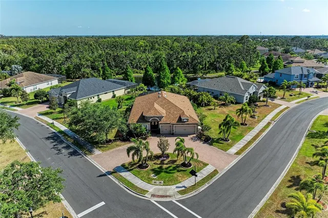 an aerial view of a house with outdoor space