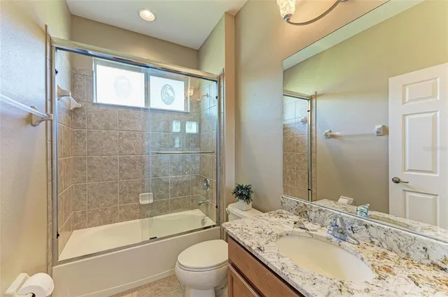 a view of a backyard with table and chairs under an umbrella
