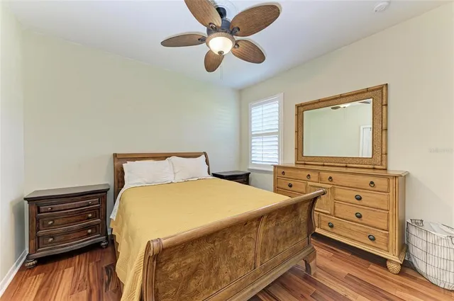 a view of a house with backyard and a tree