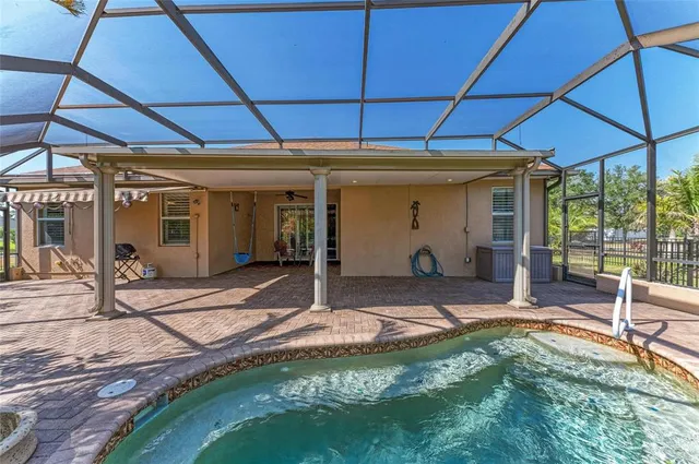 a aerial view of a house with garden space and street view