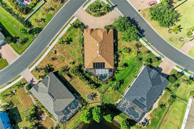 an aerial view of residential houses with outdoor space