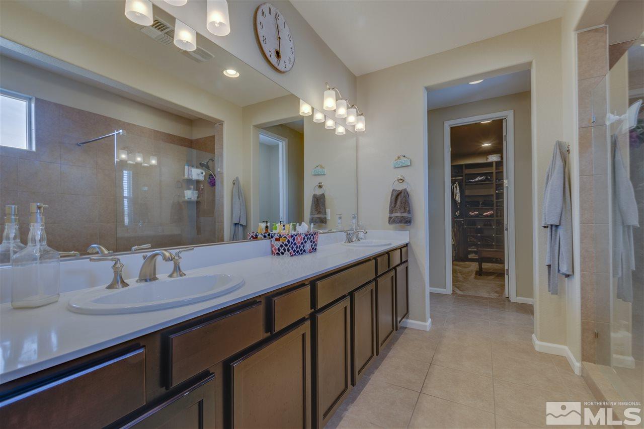 2815 Bonfire Lane Reno, NV 89521 - Photo 15 of 22 a bathroom with a double vanity sink and a mirror