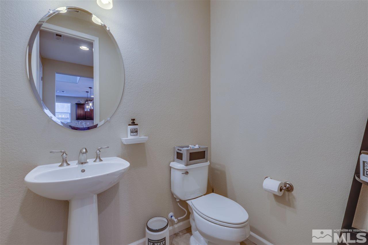 2815 Bonfire Lane Reno, NV 89521 - Photo 10 of 22 a bathroom with a toilet sink and mirror