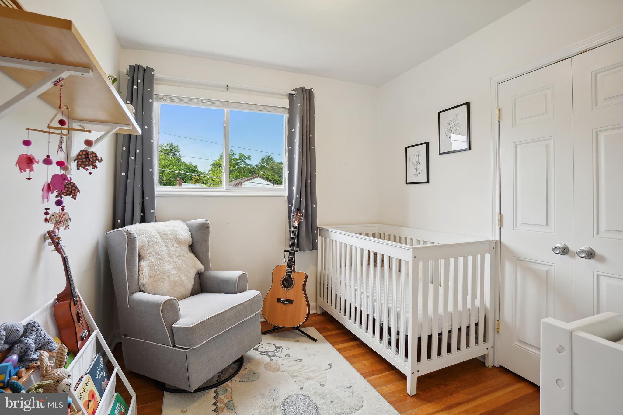 10403 Conover Drive Silver Spring, MD 20902 - Photo 18 of 38 a bedroom with furniture and a window
