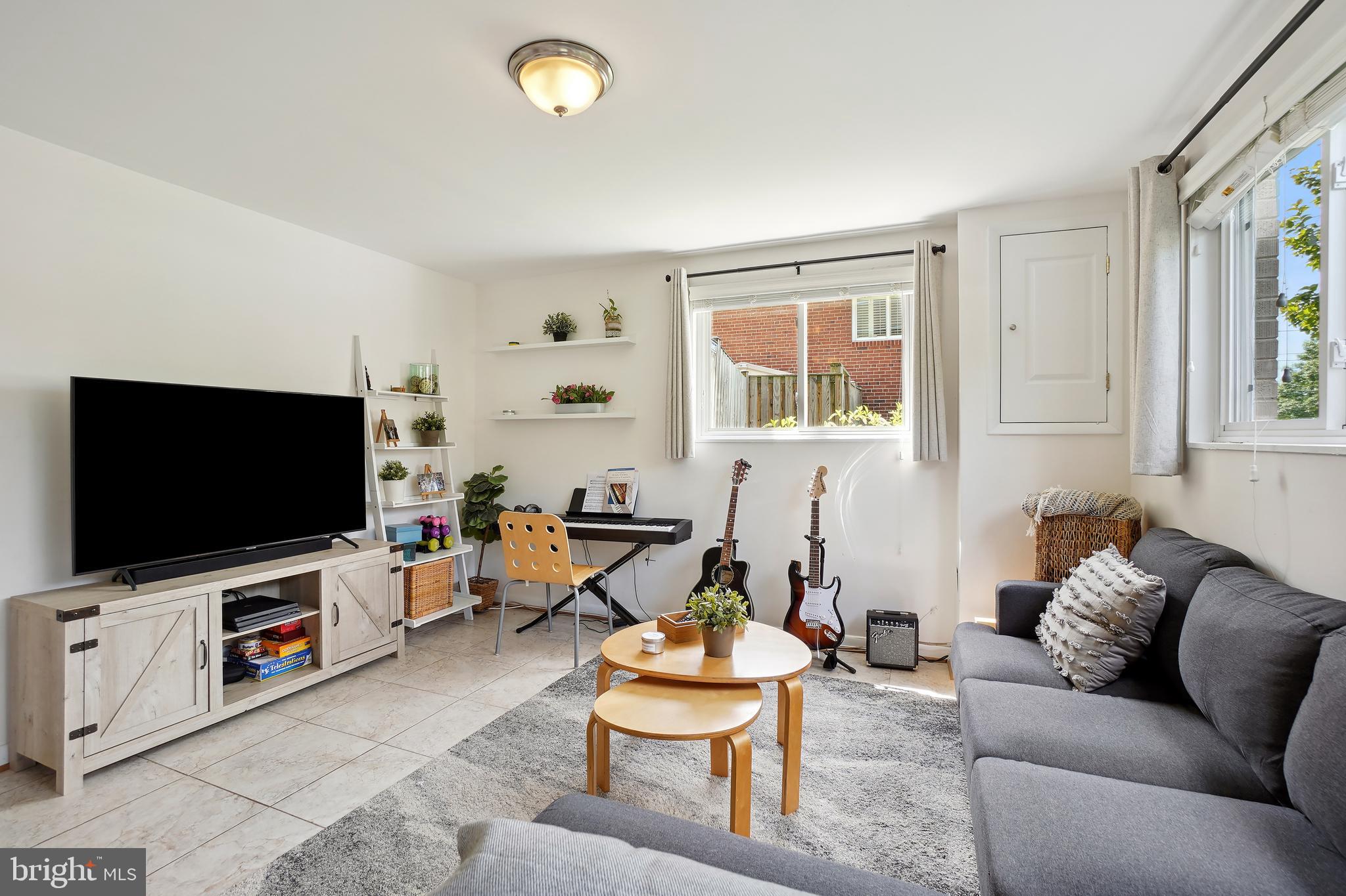 10403 Conover Drive Silver Spring, MD 20902 - Photo 24 of 38 a living room with furniture and a flat screen tv