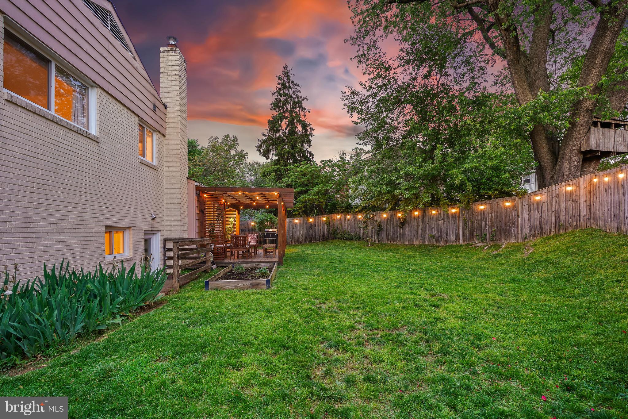 10403 Conover Drive Silver Spring, MD 20902 - Photo 33 of 38 a view of a backyard with couches under an umbrella