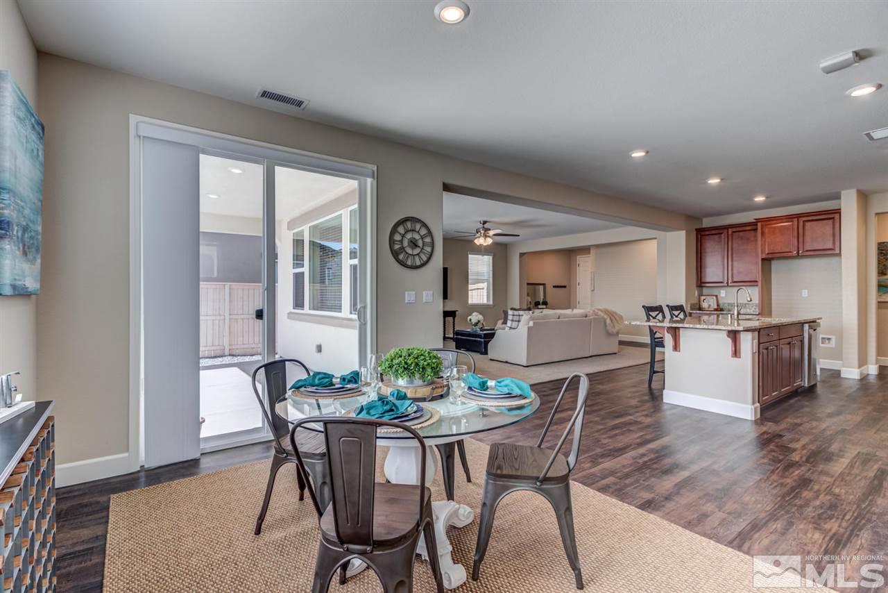 10290 Culiacan Pass Trail Reno, NV 89521 - Photo 12 of 23 a view of a dining room with furniture and wooden floor