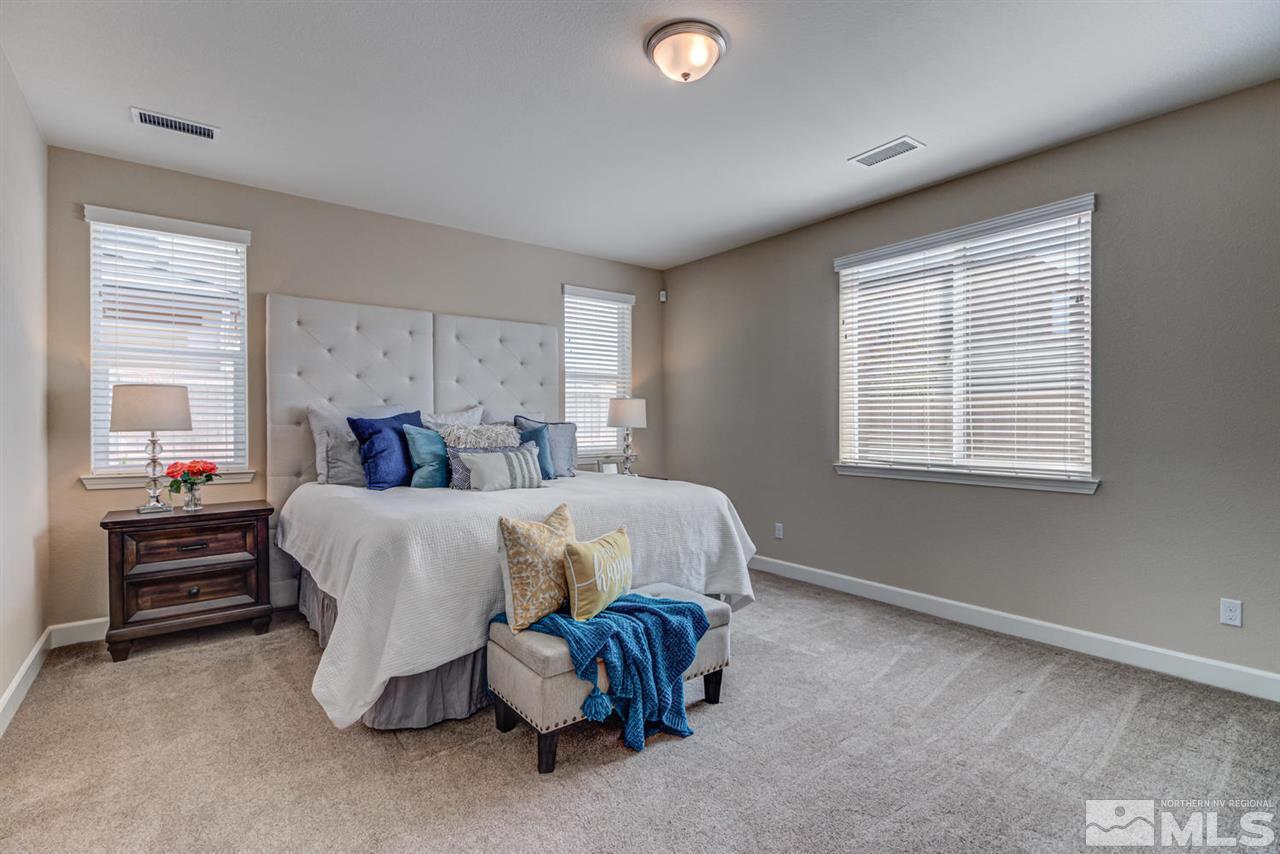 10290 Culiacan Pass Trail Reno, NV 89521 - Photo 13 of 23 a bedroom with a bed and a window