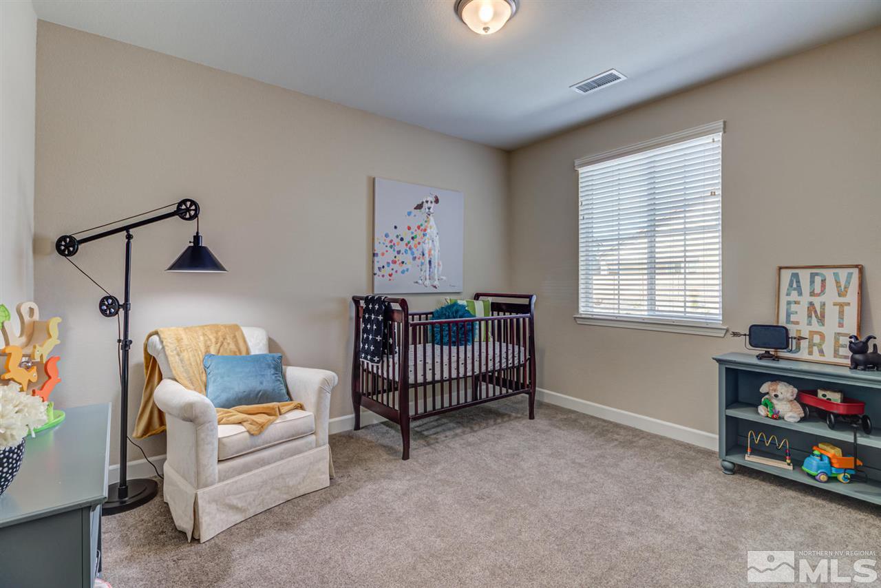 10290 Culiacan Pass Trail Reno, NV 89521 - Photo 17 of 23 a bedroom with furniture and a window