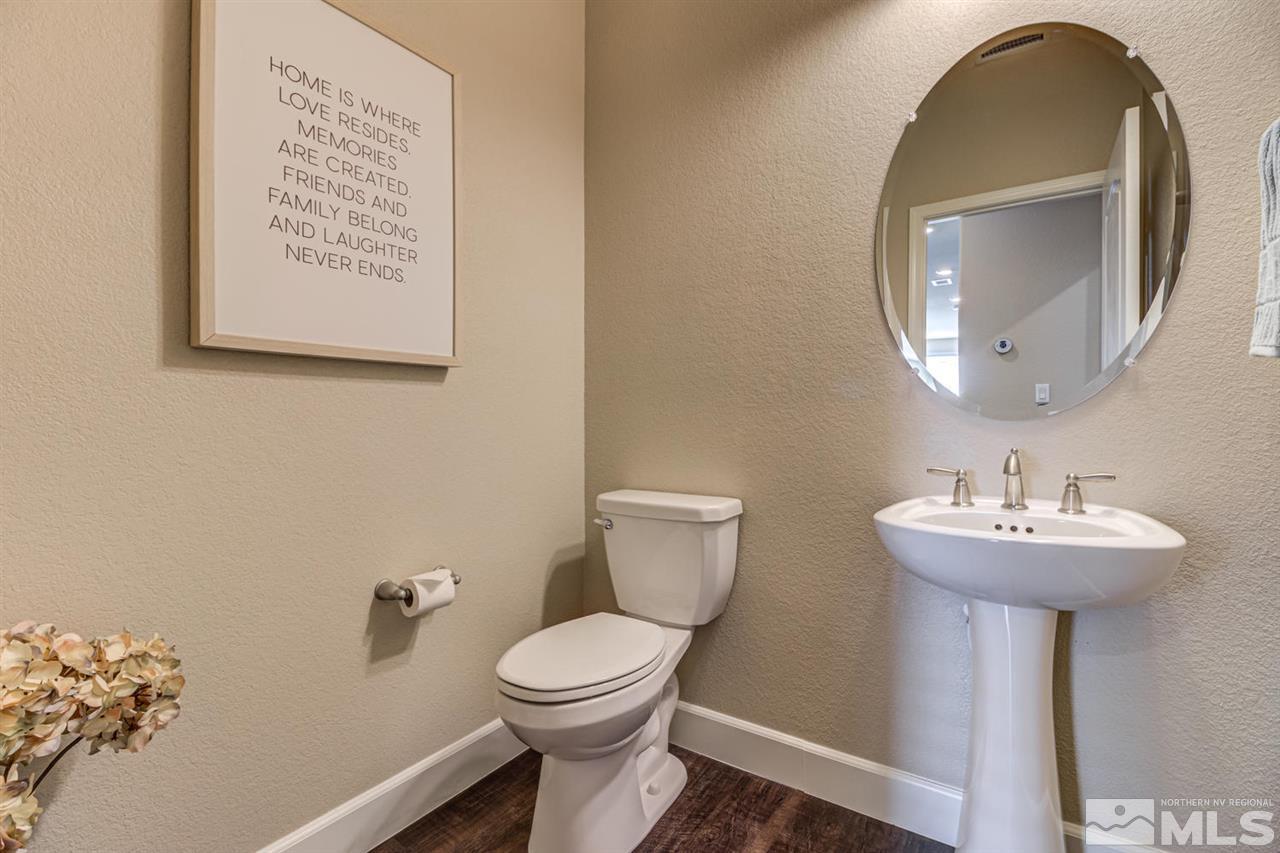 10290 Culiacan Pass Trail Reno, NV 89521 - Photo 19 of 23 a bathroom with a toilet sink and mirror